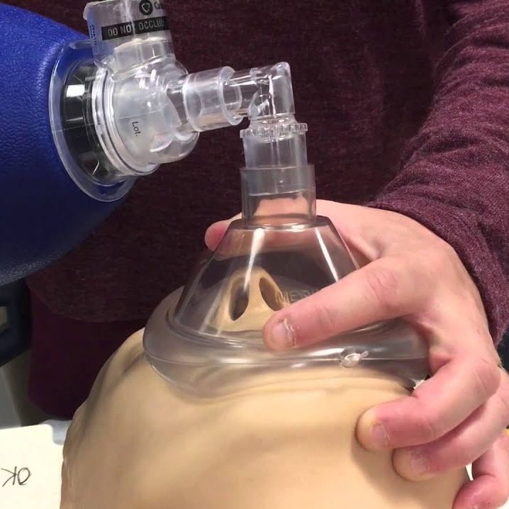 using a pocket mask where should the rescuer be positioned